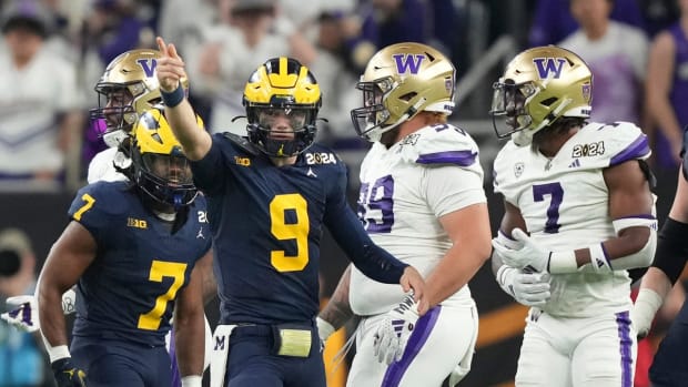 Michigan quarterback J.J. McCarthy points down the field during the second half of the College Football Playoff national championship game against Washington at NRG Stadium in Houston, Texas on Monday, Jan. 8, 2024.